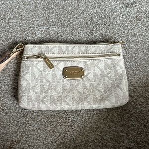 Michael Kors monogram, wristlet cream color with gold hardware